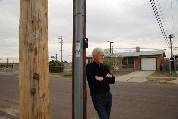 Keith Morrison leans on a pole near the crime scene.